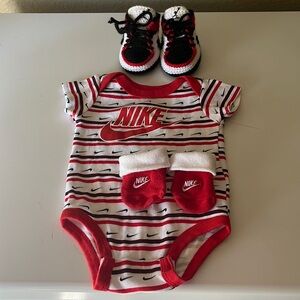 NWOT Nike Onsie, socks, and crib shoes